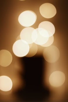 Abstract bokeh lights creating a warm, golden glow with a soft focus.