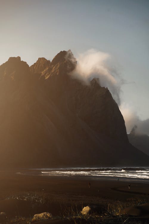 Massive mountain on coast near sea