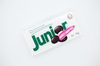 Top view of small rectangular shaped box with inscriptions and illustration of mint sweets on white background