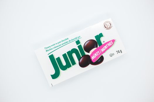 Top view of small rectangular shaped box with inscriptions and illustration of mint sweets on white background