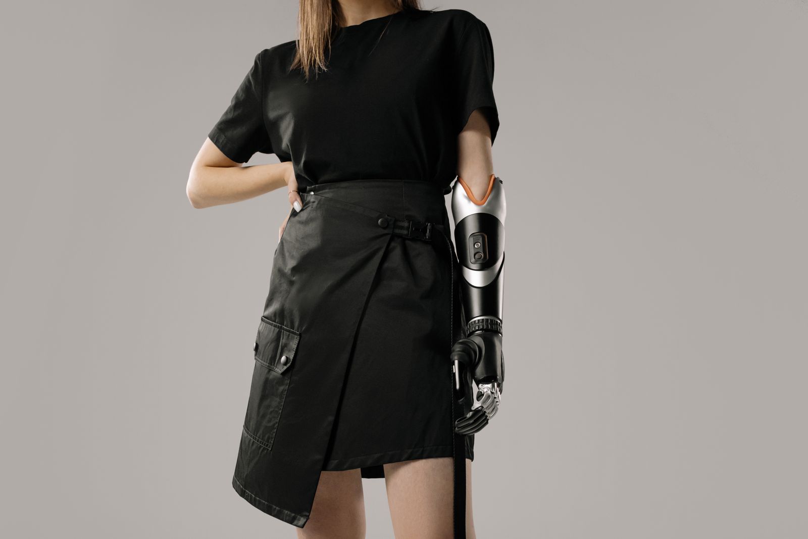 Person adjusting a wrist brace at a bright desk before daily activity
