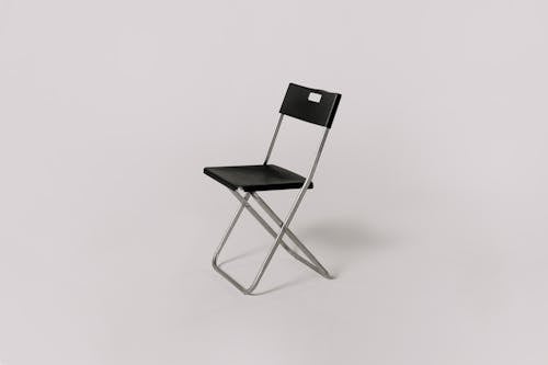 Still Life Photography of a Chair on Gray Background