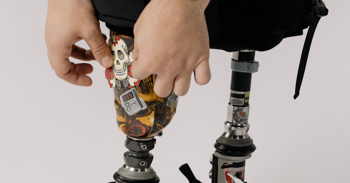 Close-Up Shot of a Person Putting Sticker on Prosthetic Legs · Free ...