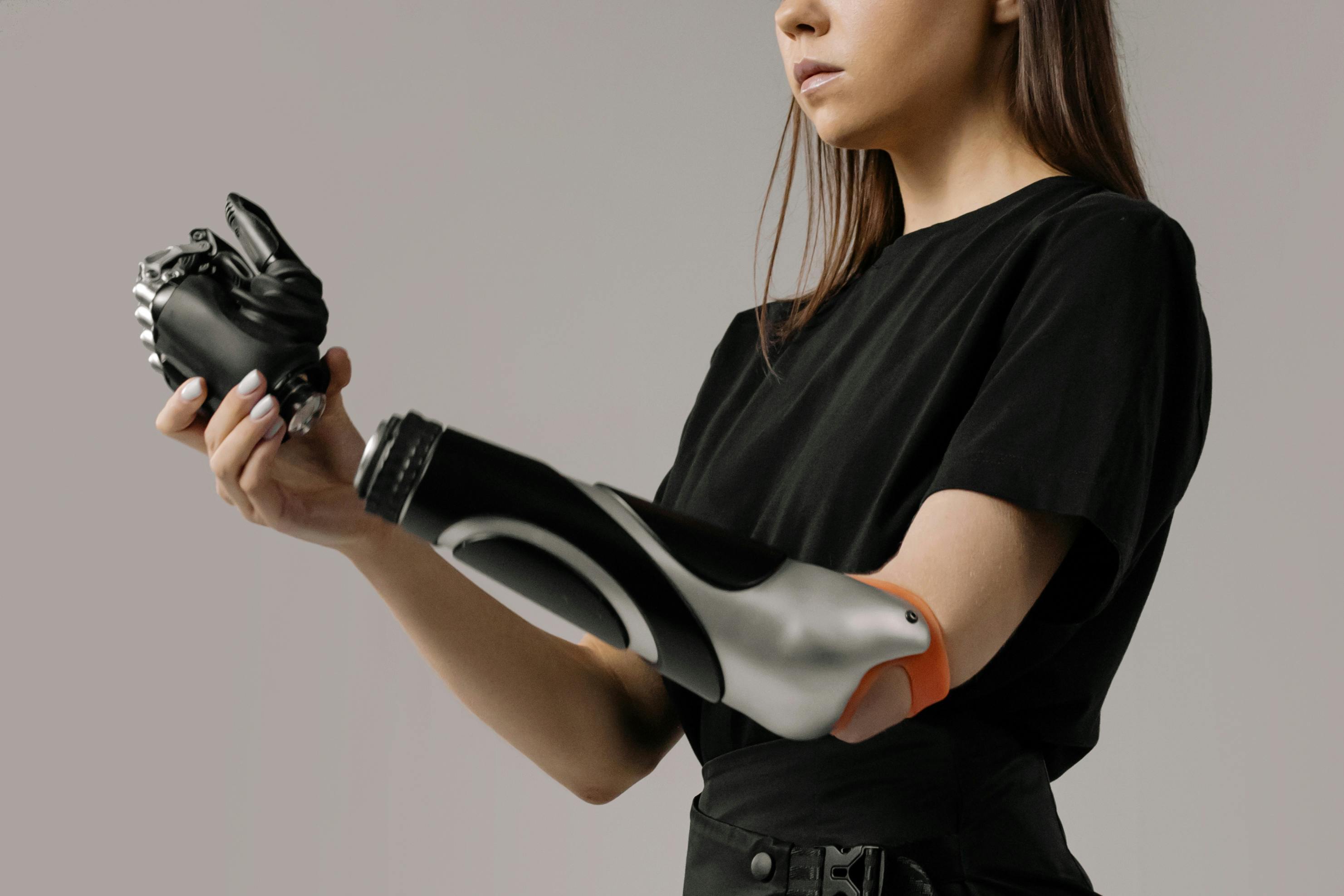 woman in black t shirt holding black and white leather gloves