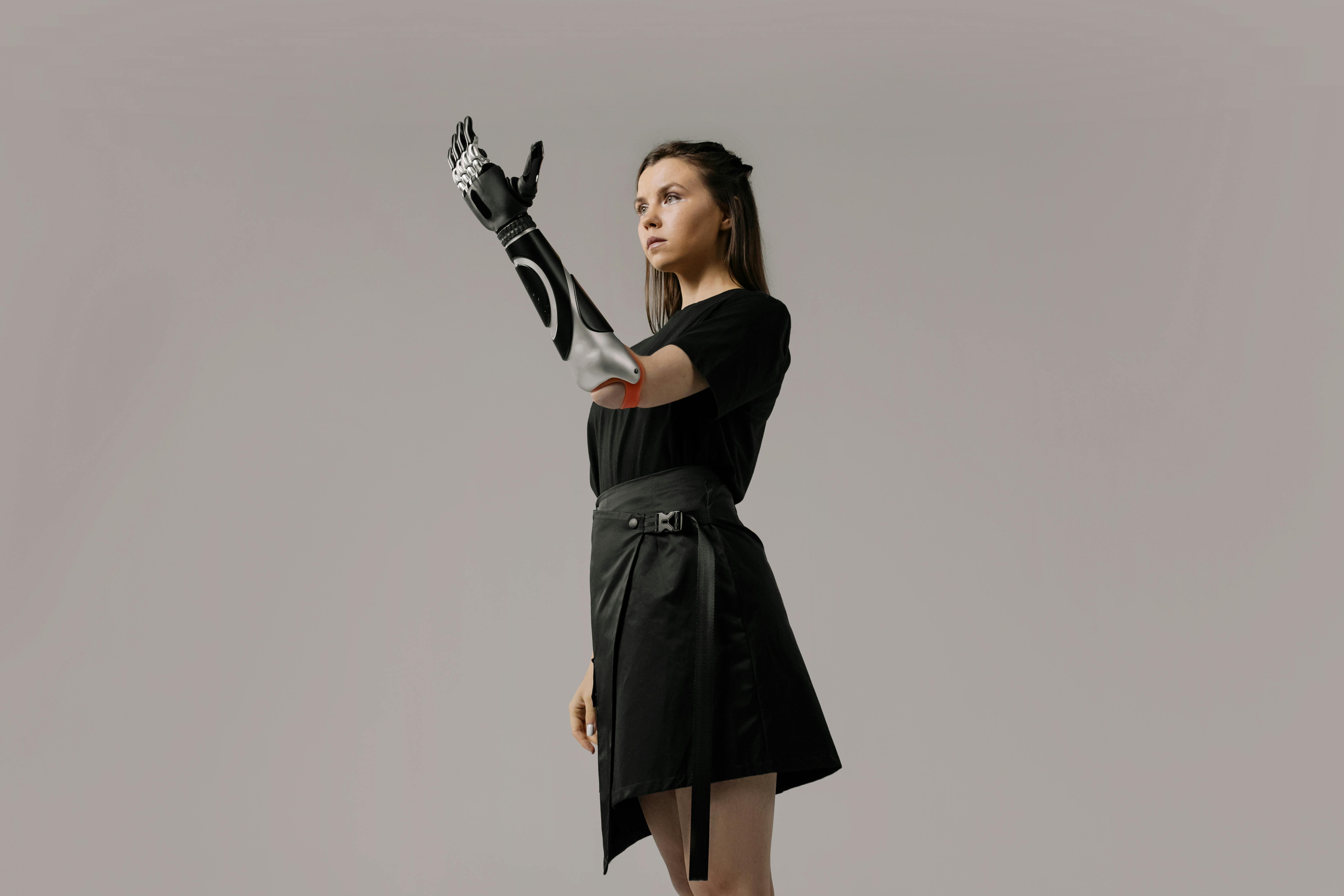 woman in black dress with black leather gloves