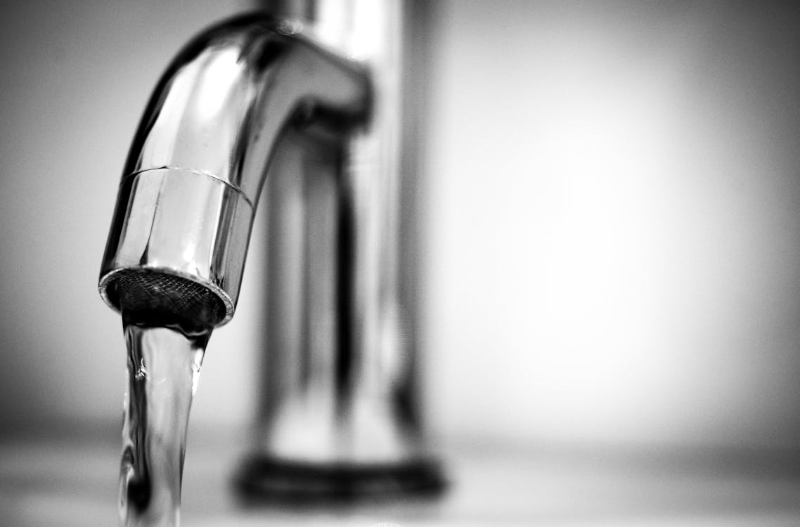 Free Macro Photography of a Stainless Steel Faucet  Stock Photo