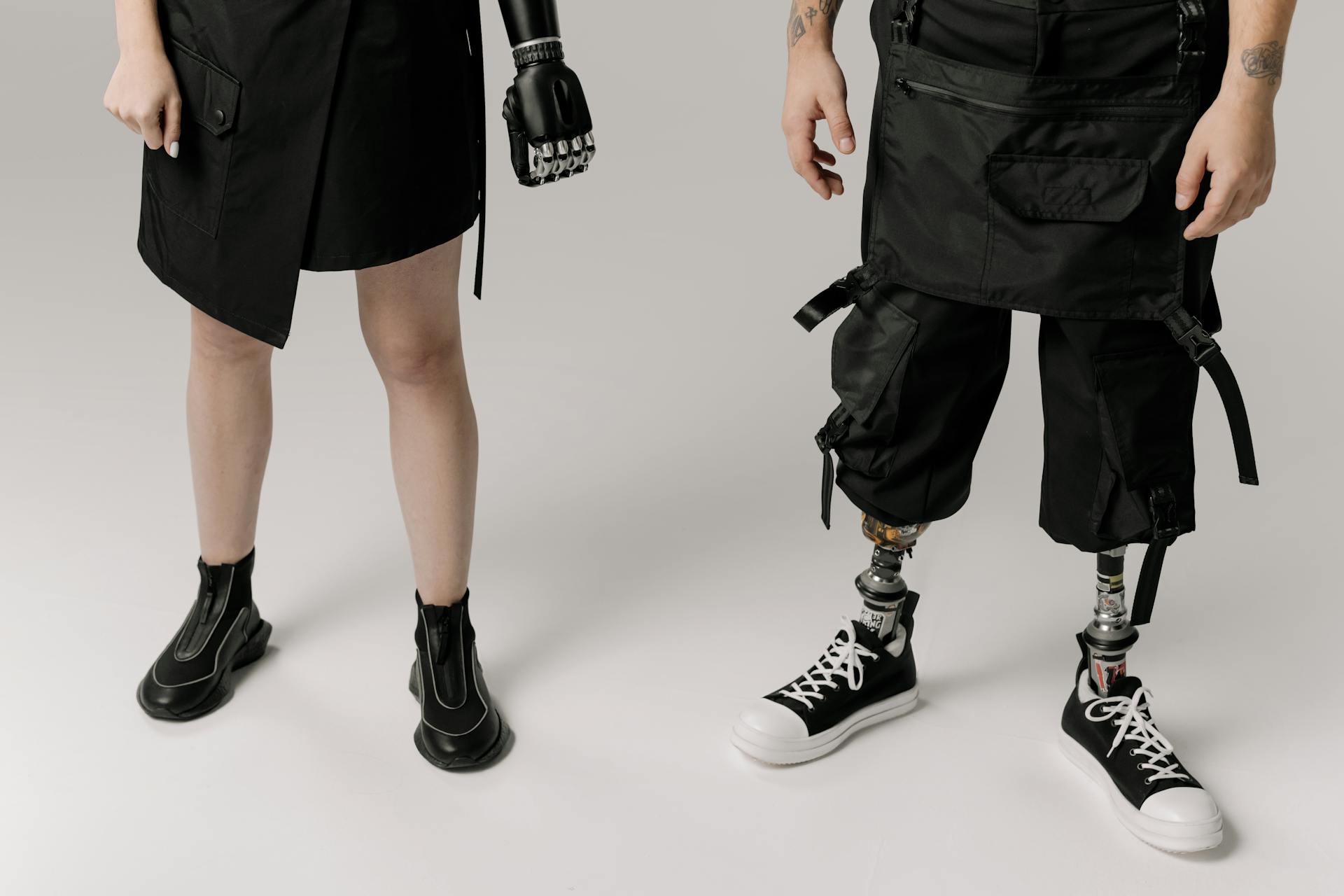 Woman With Bionic Hand and Person With Prosthetic Legs