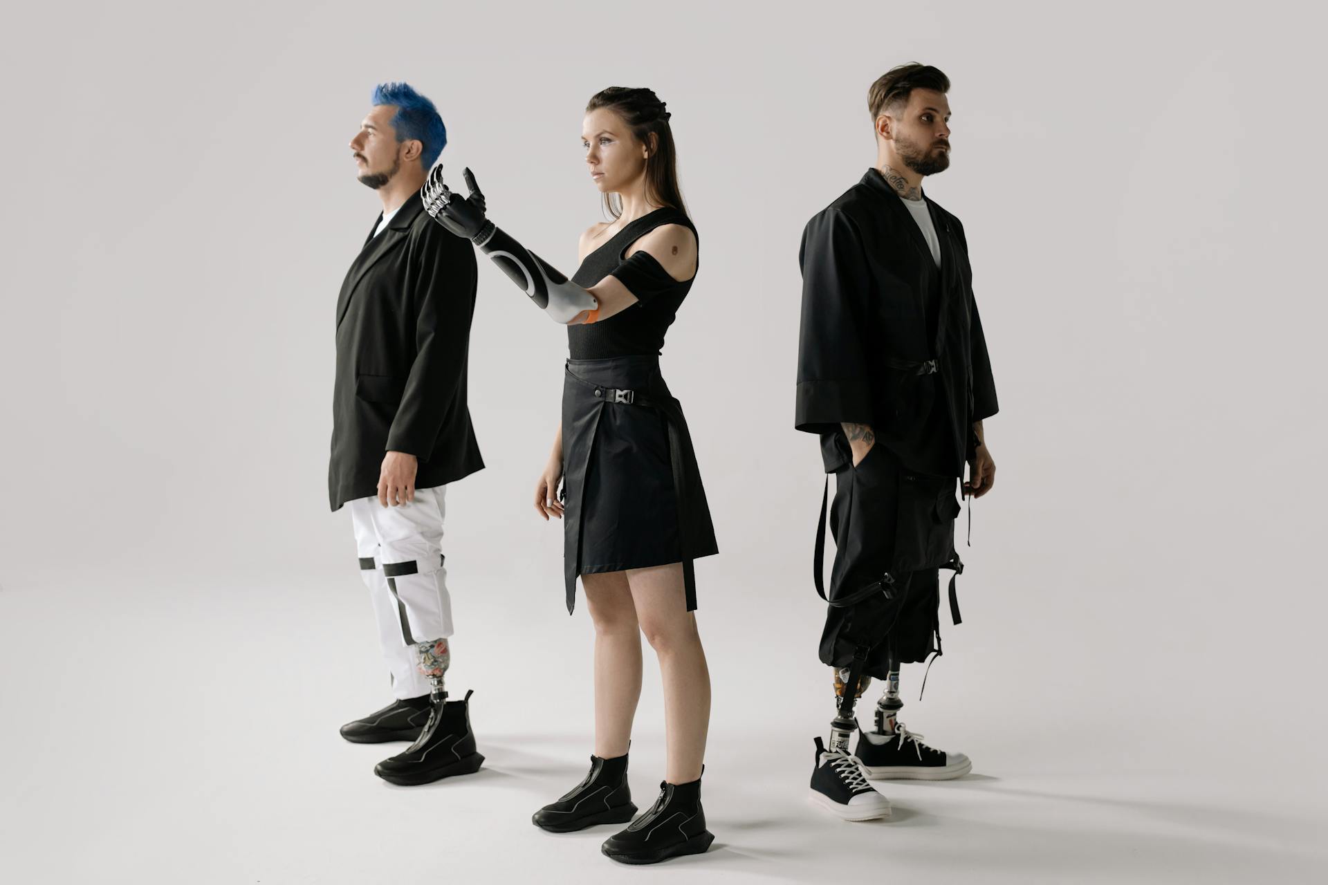 Group showcasing modern fashion and prosthetic technology, blending style and innovation.