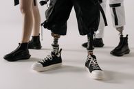 Person in Black and White Nike Sneakers
