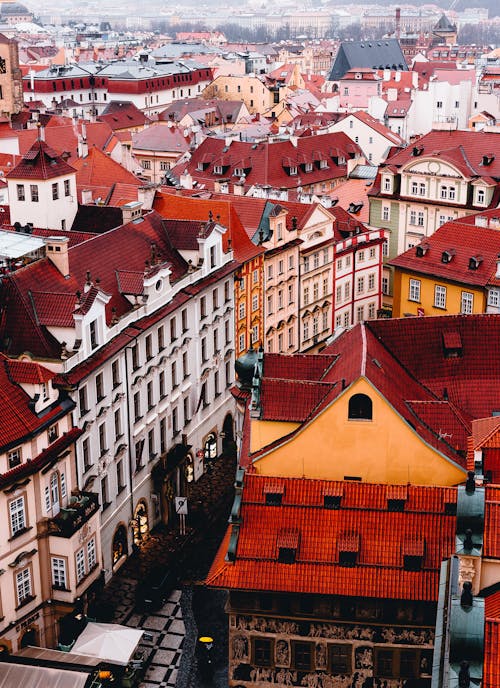 From above of old European city with classic residential houses with colorful roofs
