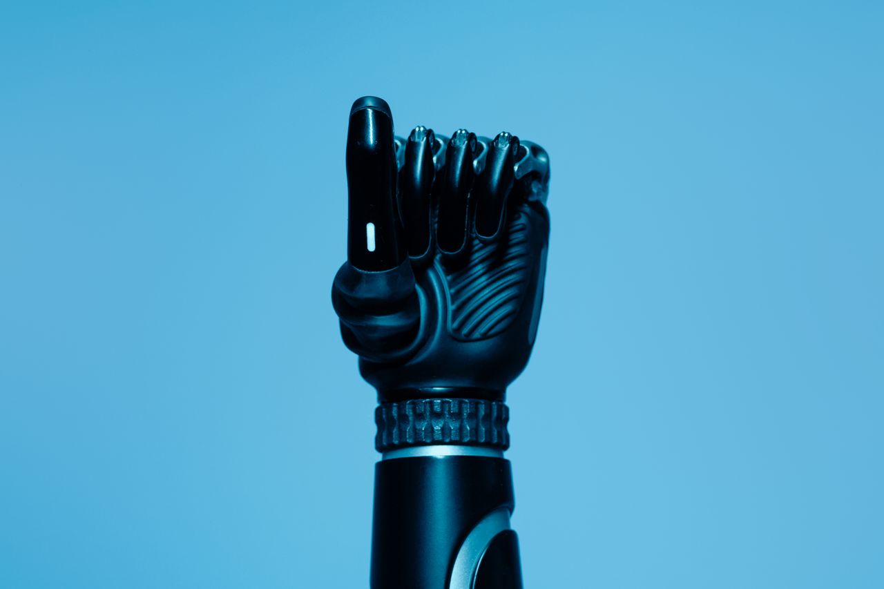 close up of a prosthetic arm in a vibrant blue setting showcasing adva