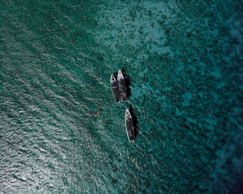 Ships floating over ocean surface