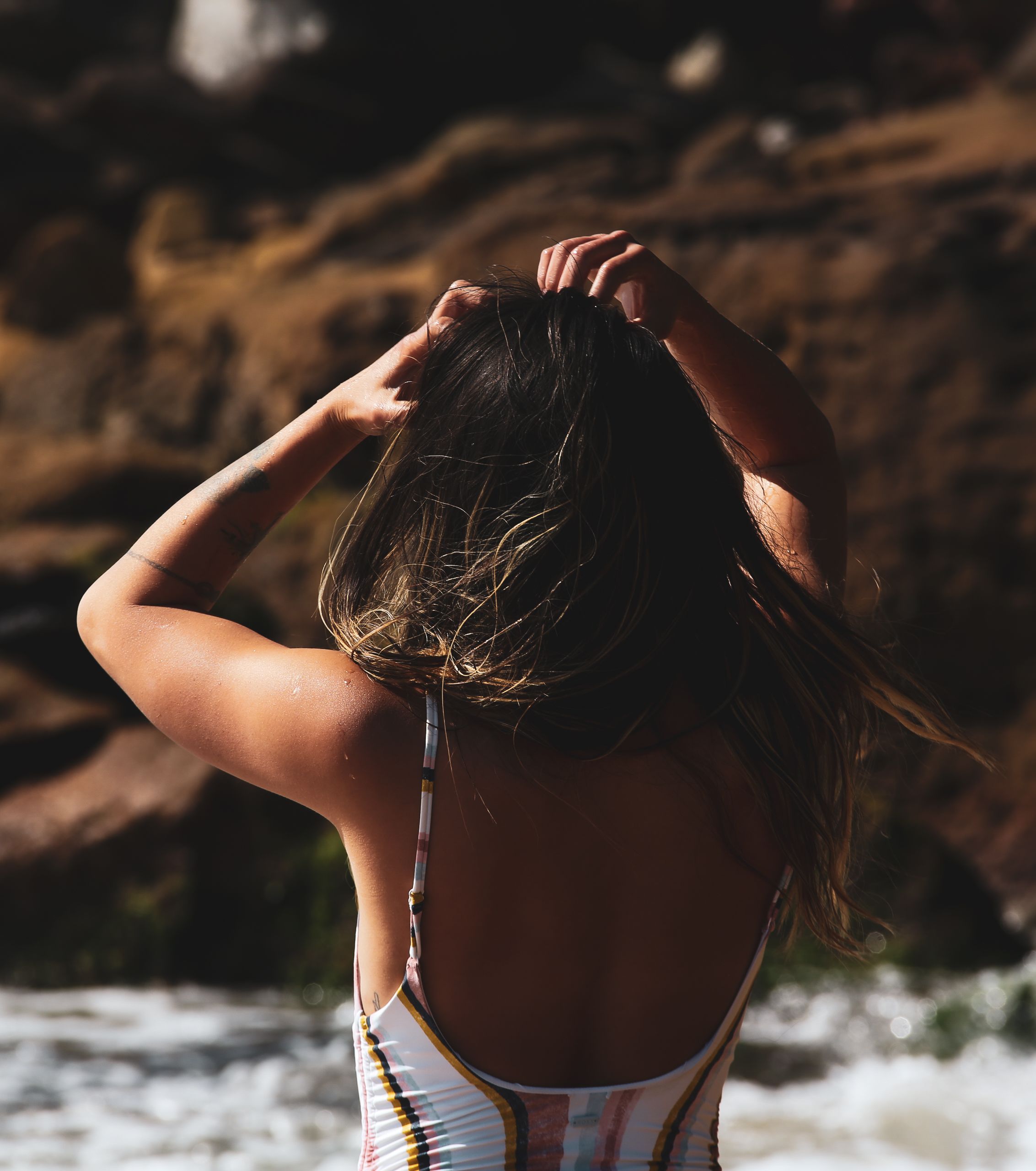 Woman Wearing a Striped Bathing Suit · Free Stock Photo