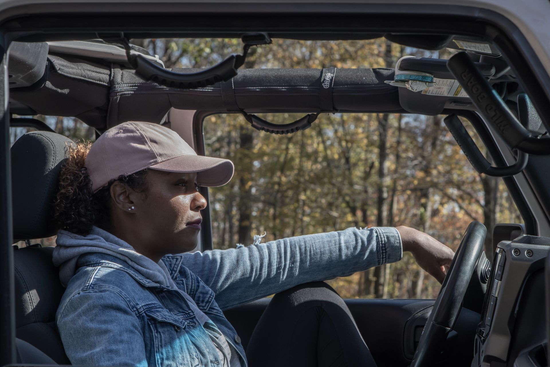 Middle-aged woman enjoying a drive through the scenic autumn countryside in Ellicott City.