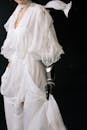 Woman in White Dress with Prosthetic Hand