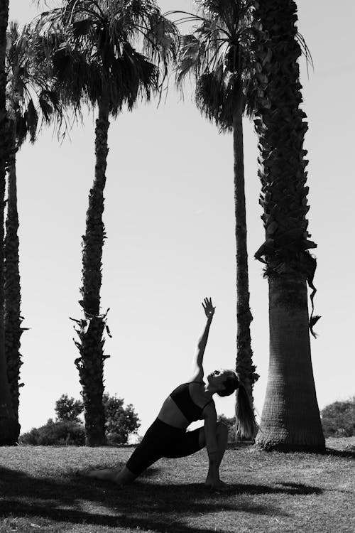 Grayscale Photo of a Woman Doing Yoga 