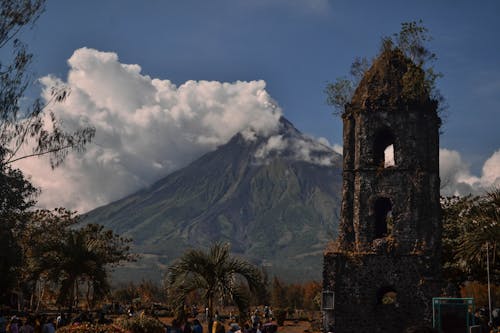 Landscape with Clouds over Volcano Mountain and Old Ruin in Foreground