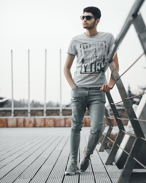 A Man Leaning on a Railing