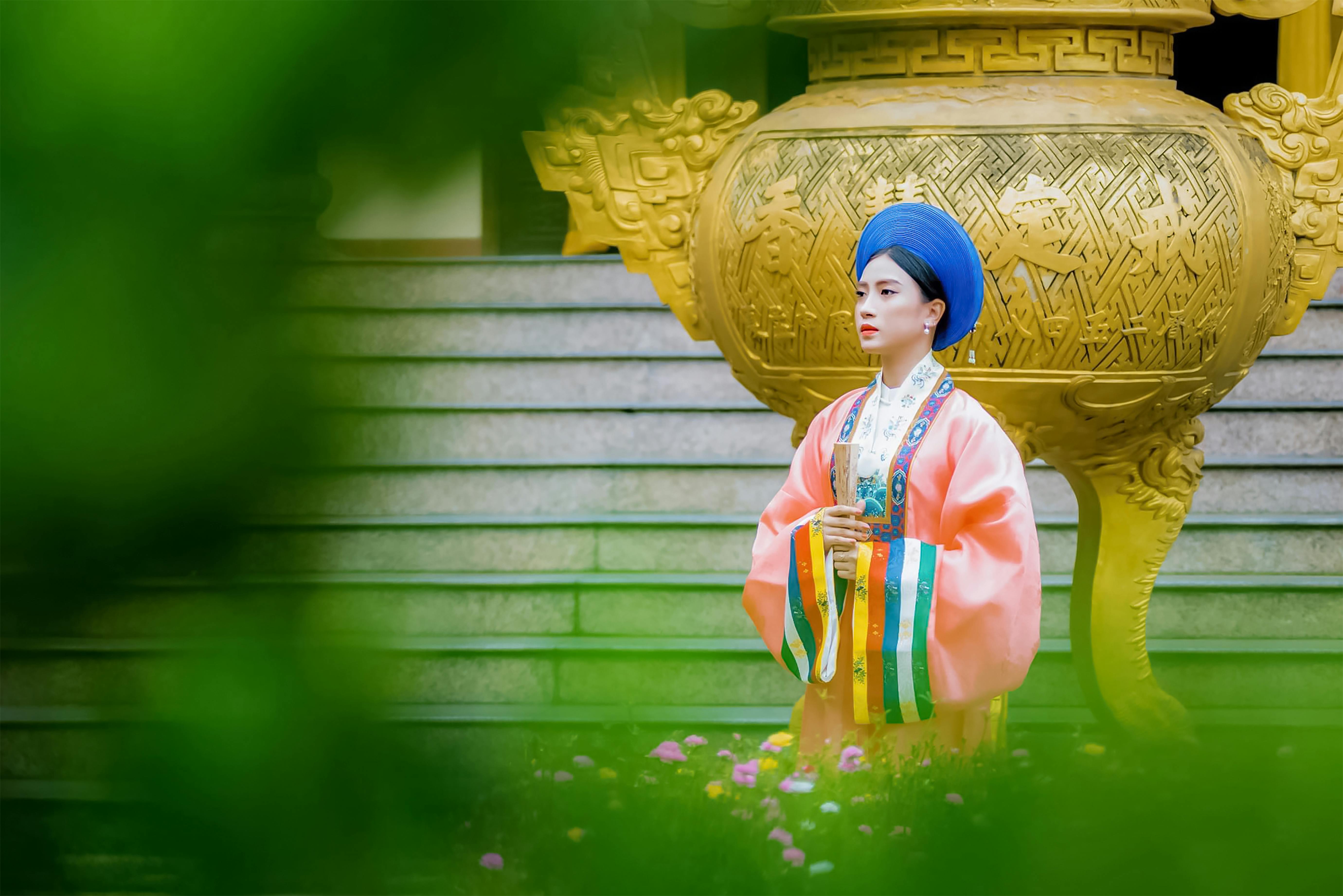 a pretty woman in pink kimono