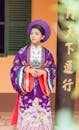 A Pretty Woman in Purple Kimono Standing