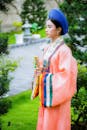 A Woman in Pink Kimono Standing in the Garden
