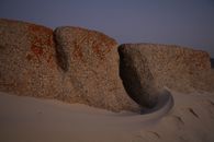 Stones in sandy terrain in evening