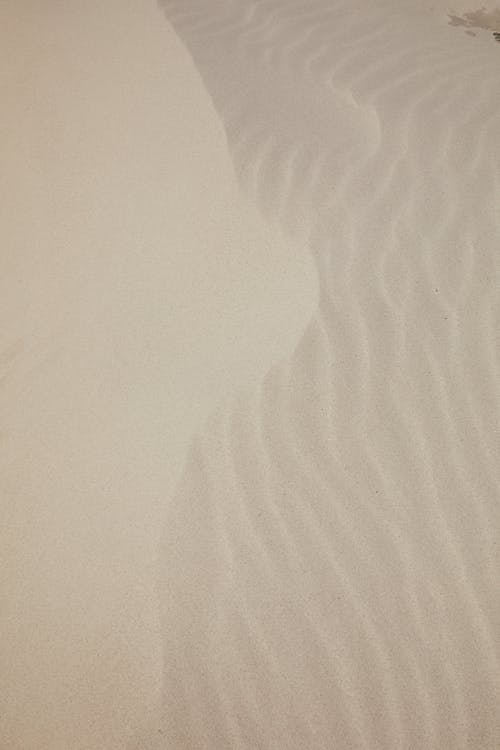 Free White sandy surface on sea shore Stock Photo