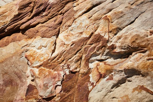 Top view of rough rocky formation surface with uneven bristly texture and relief