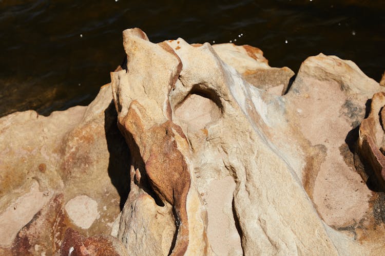 Rough Sandstone On River Bank