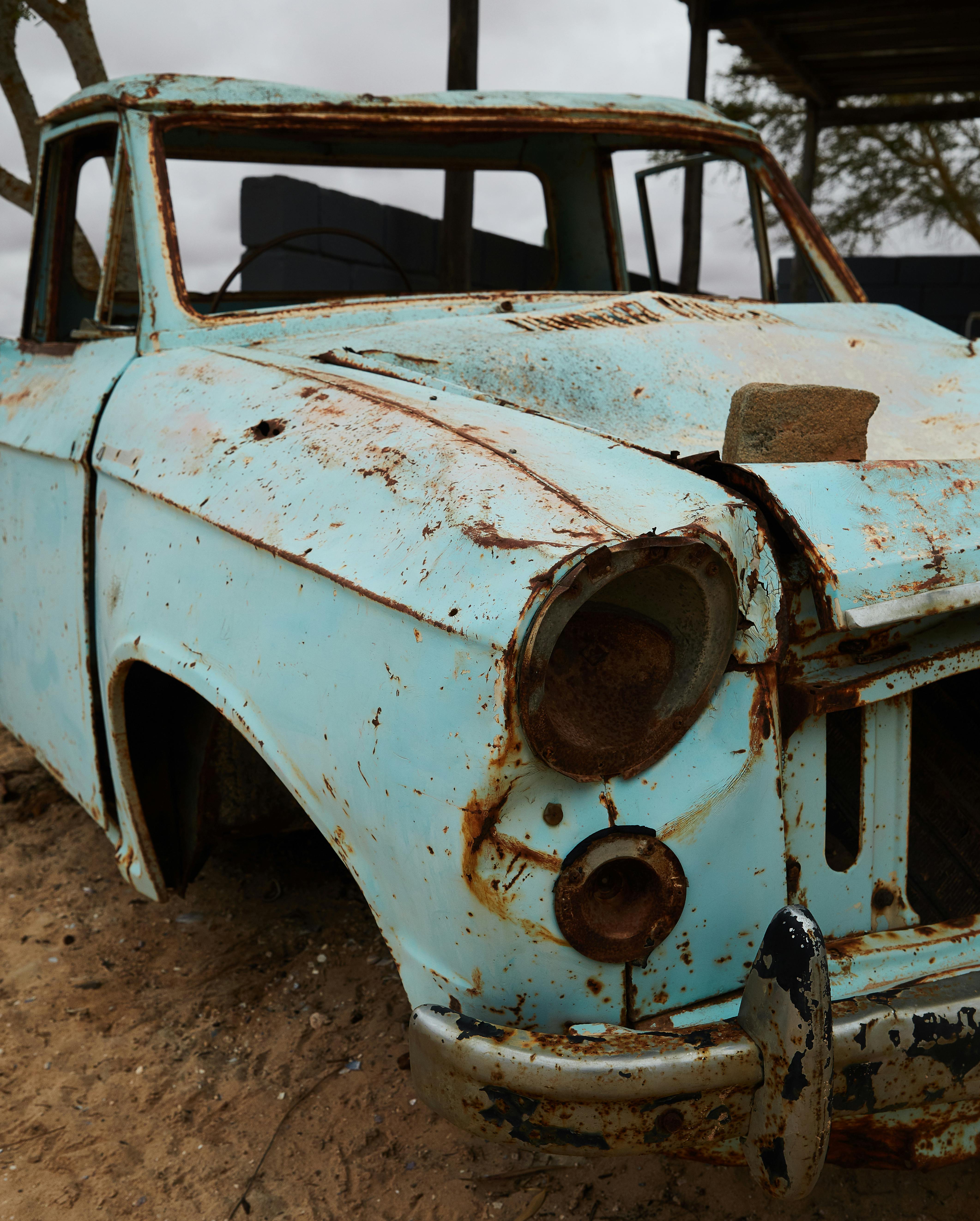 rusty broken car without wheels