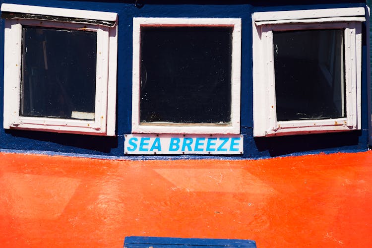 Wheelhouse Of Motor Ship With Windows And Inscription Sea Breeze