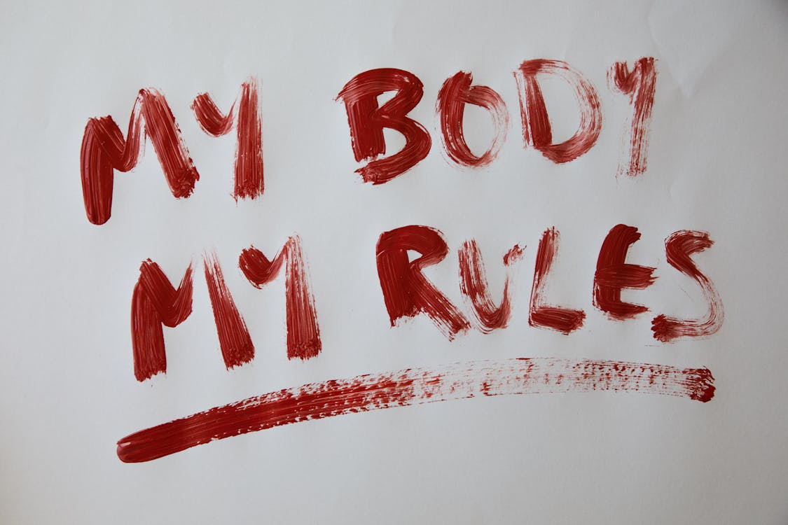 Free Inscription My body my rules against gray background Stock Photo