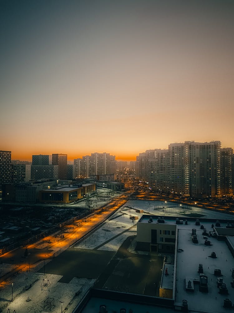 Modern Megapolis District With High Buildings At Sunset