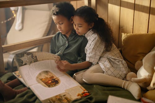 Free Two Kids Reading a Fairy Tale Book Stock Photo