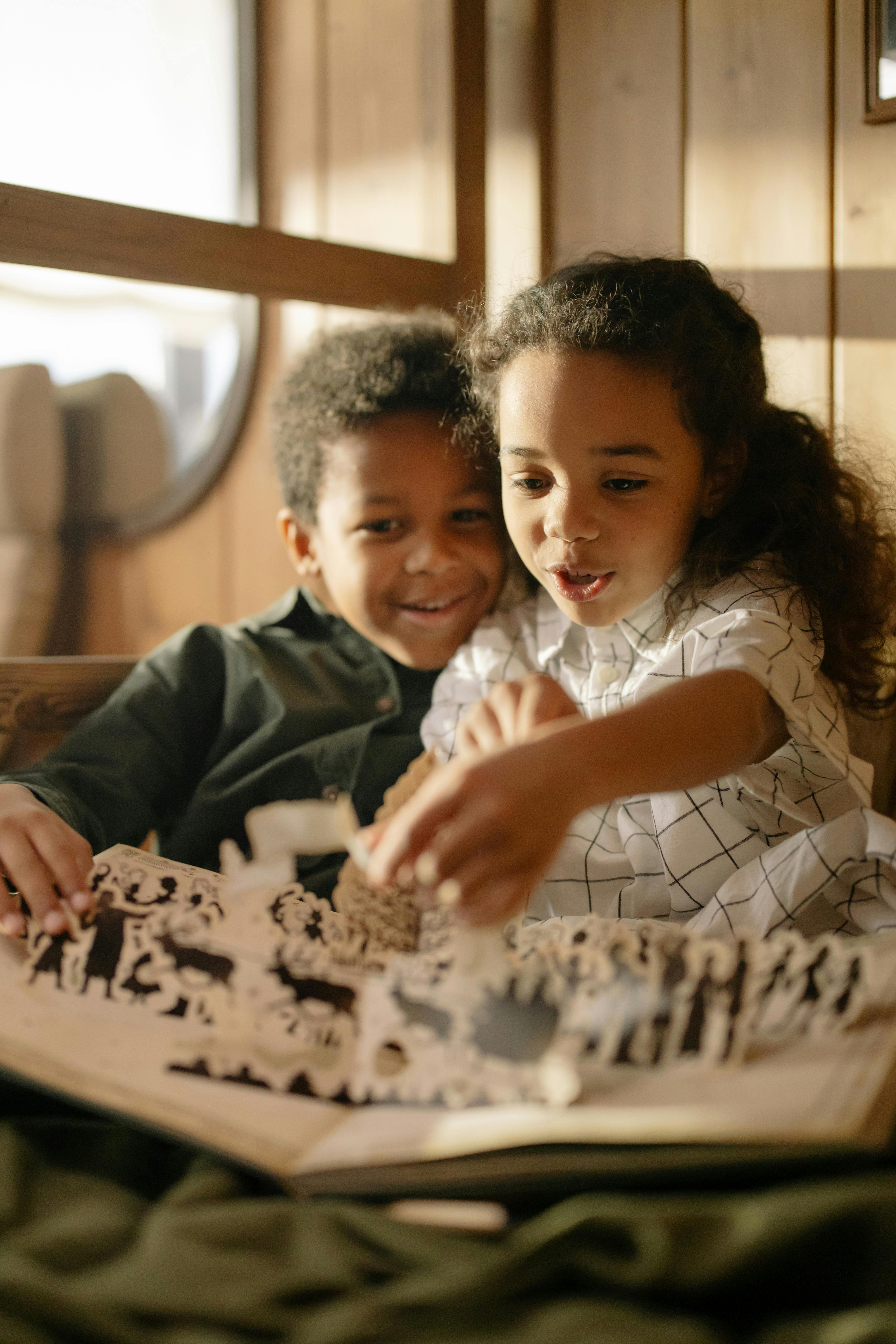 two kids reading a fairy tale book