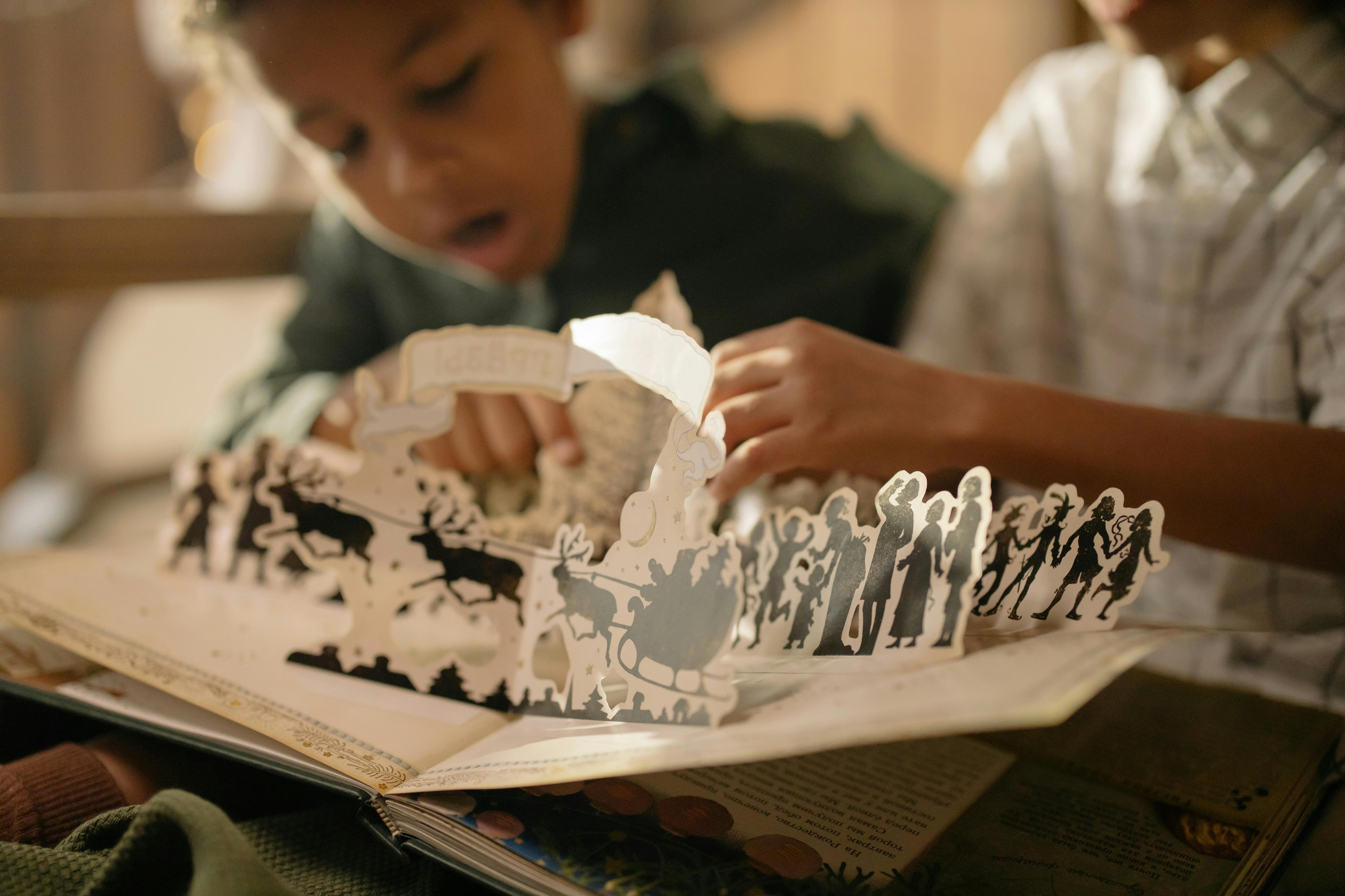 two kids reading a cutouts fairy tale book