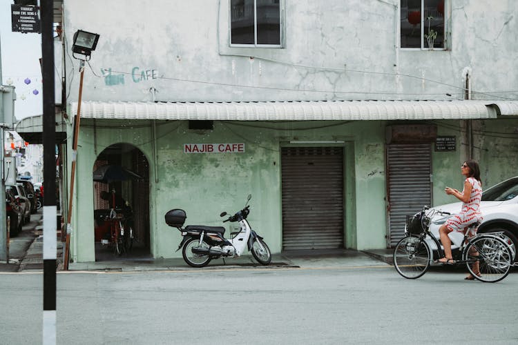 Motorcycle Parked Near Shabby Building