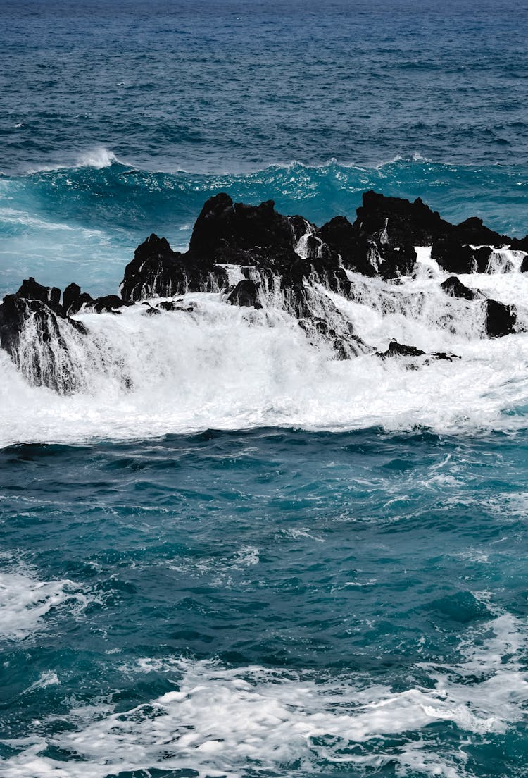 Ocean Waves Crashing On Rock Formation