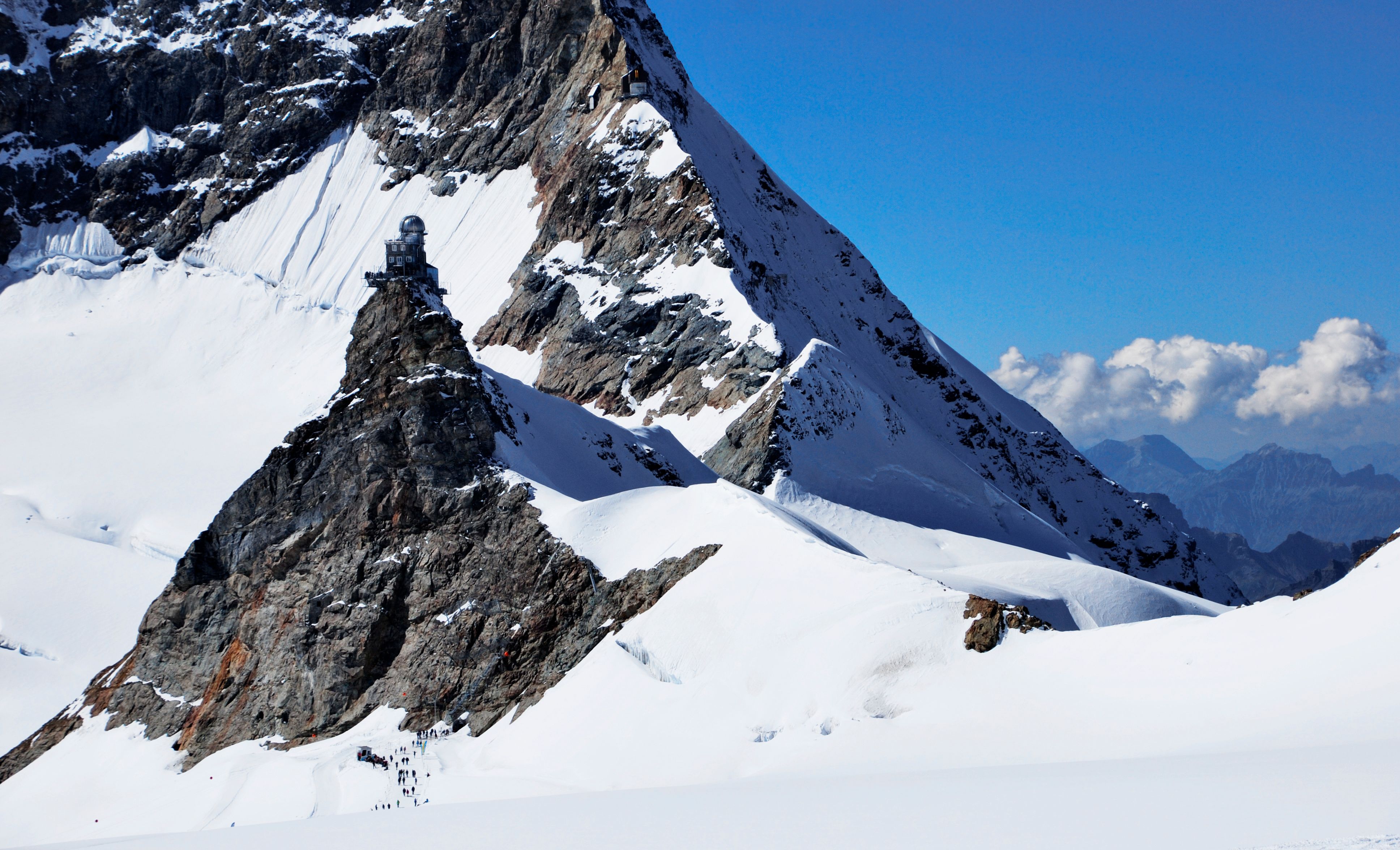 Panoramic view from Jungfraujoch, the Top of Europe, in the Swiss Alps, highlighting a popular day trip destination.