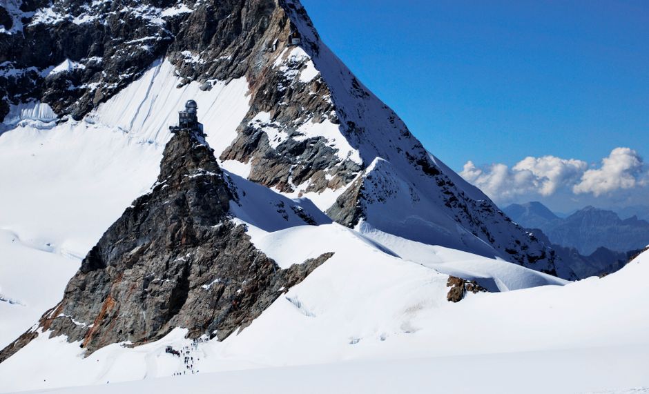 Panoramic view from Jungfraujoch, the Top of Europe, in the Swiss Alps, highlighting a popular day trip destination.