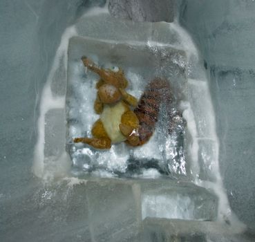 Toy encased in ice, captured in a winter setting. Perfect for seasonal themes.
