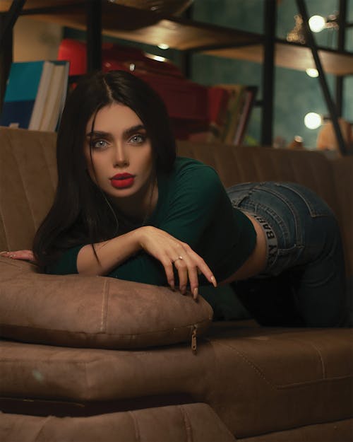Brunette Woman Posing on a Couch 