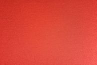 Textured background of red fabric with rough surface