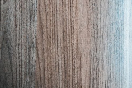 Free Overhead view of textured backdrop representing wooden desk of beige and gray color with curved lines Stock Photo