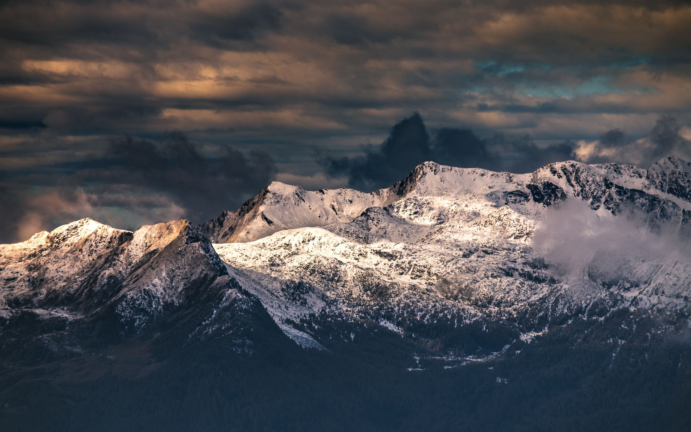 Snow Covered Mountain Under Dark Clouds · Free Stock Photo