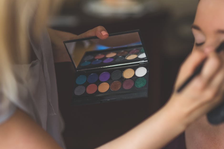 Make-up artist applying eyeshadows