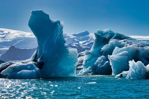 Free Stunning view of towering icebergs floating in Jokulsarlon, Iceland's glacial lagoon. Stock Photo