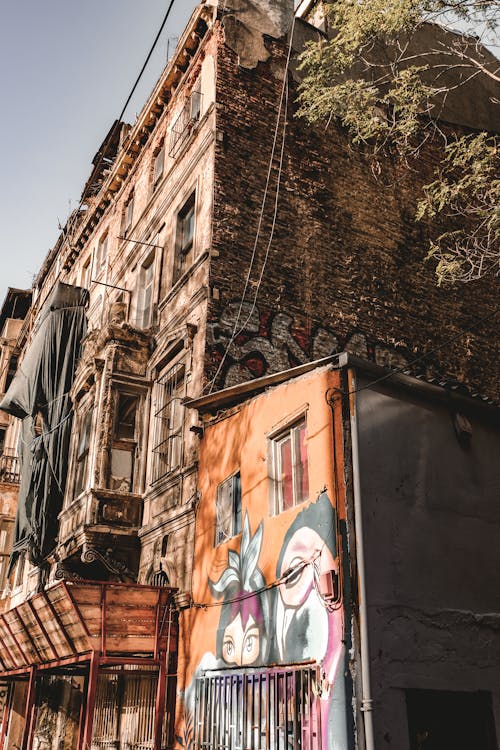Free Old City Building with Mural on Wall Stock Photo