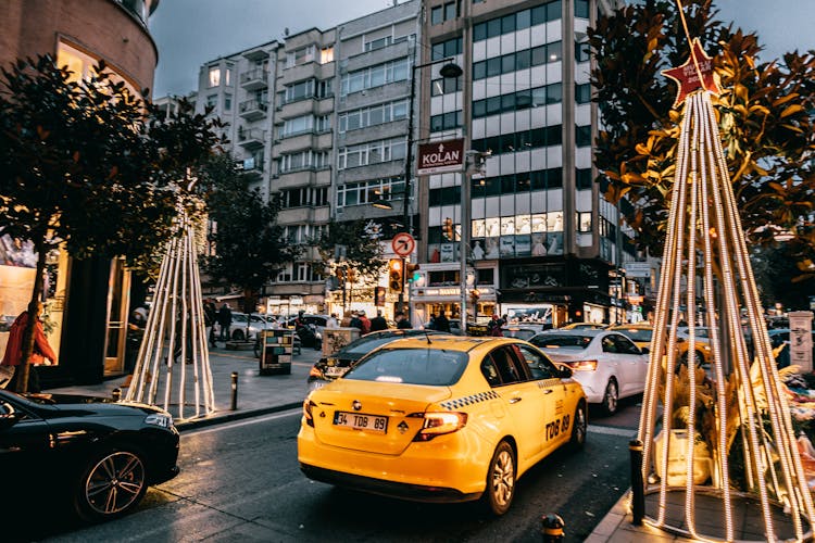 Taxi Car And Vehicles Driving On City Road