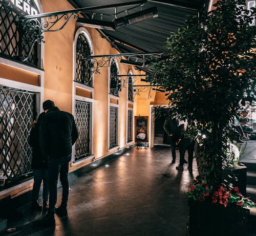 People standing near entrance of cafe